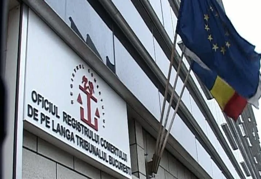FIRMA CARE A FĂCUT PLATFORMA OFICIULUI COMERȚULUI, LEGĂTURI CU STATUL PARALEL AL LUI COLDEA ȘI DUMBRAVĂ